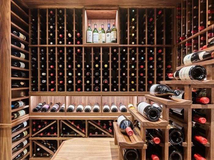 Wooden Wine Racks on the Sidewalls of the Basement Home Wine Cellar in Vancouver